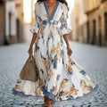 Women's Floral Print Maxi Dress With Deep V-Neck & Flare Sleeves White